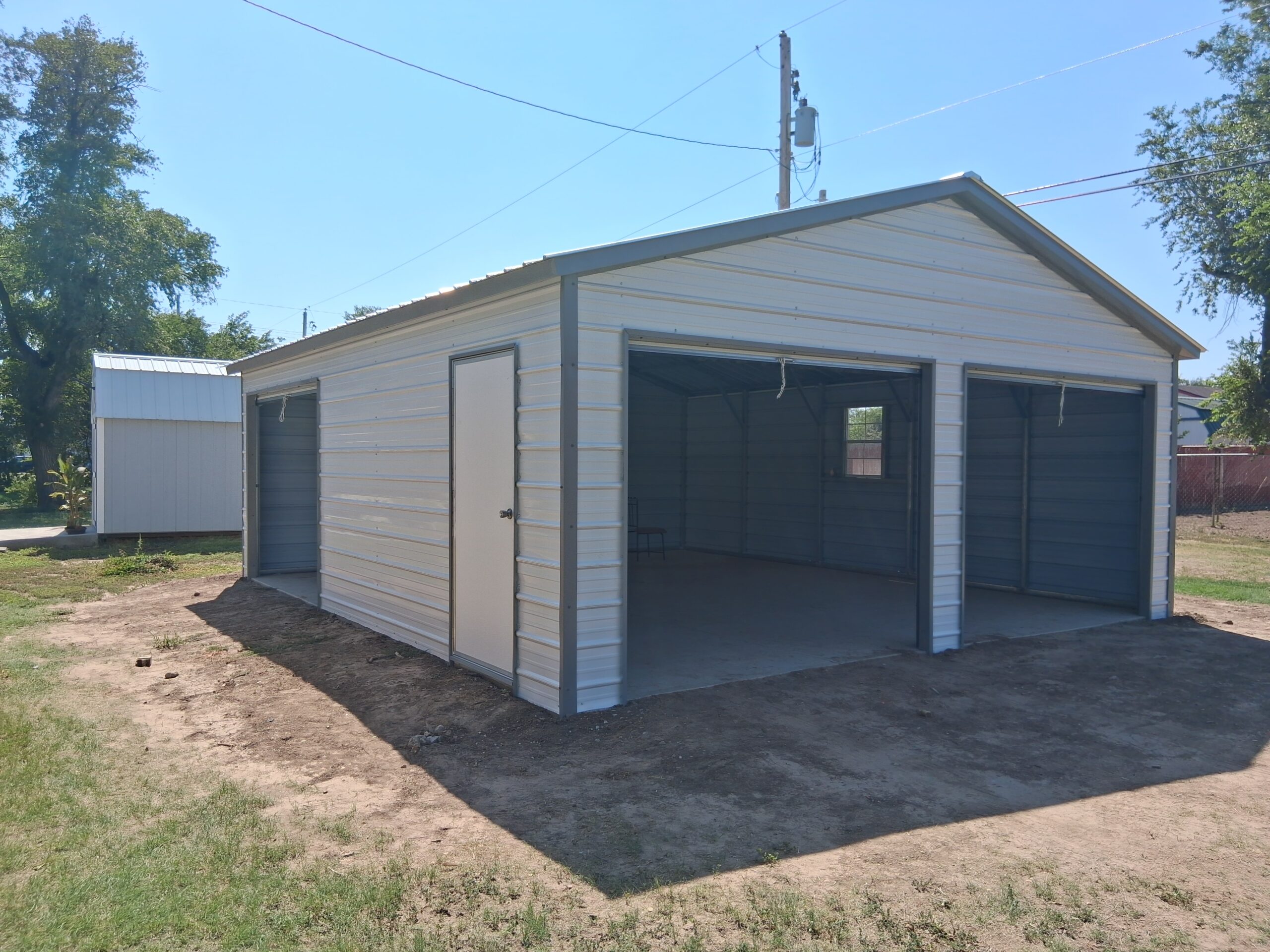 Cream and gray fully enclosed metal garage